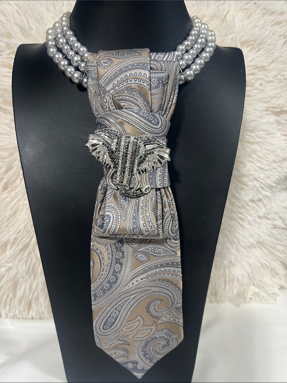 Elegant Silver Pearl Necklace with Paisley Tie and Elephant Brooch